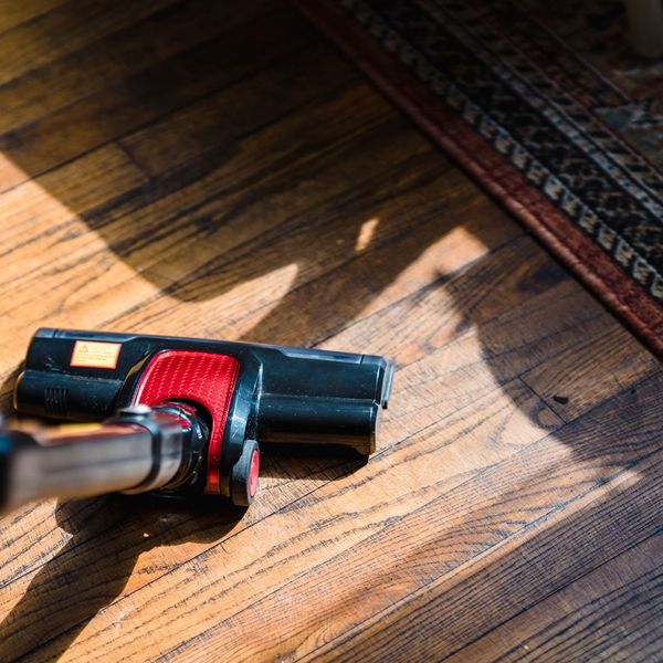 vacuuming floor next to rug vacuuming floor next to rug