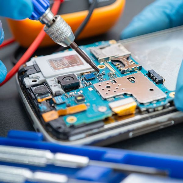 Close up of opened cell phone getting repaired Close up of opened cell phone getting repaired