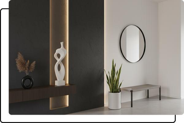 A minimalist entryway with a dark accent wall, featuring a brightly illuminated vertical LED niche that showcases an elegant white sculpture.