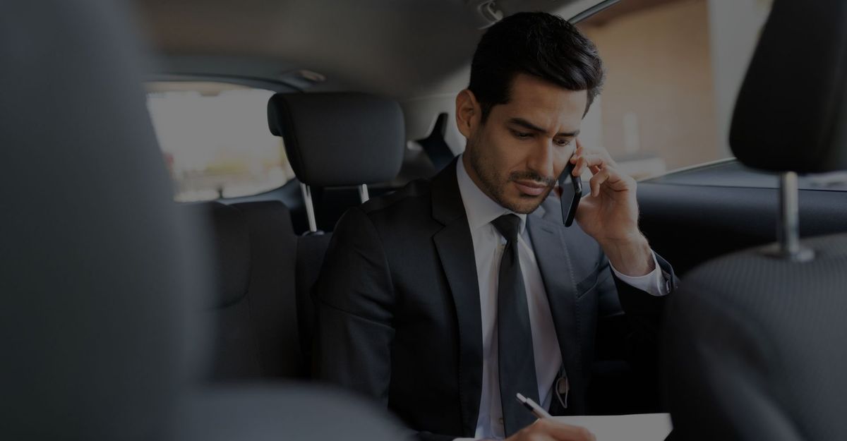 Man in a black car