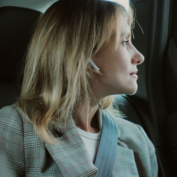 woman riding in backseat