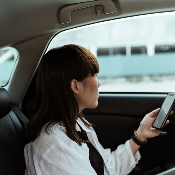 woman riding in backseat