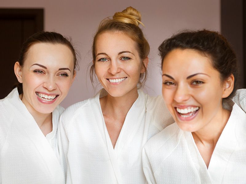 Image of three woman in robes