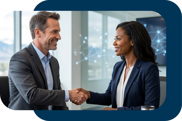 Business professionals shaking hands to signify successful technology implementation.