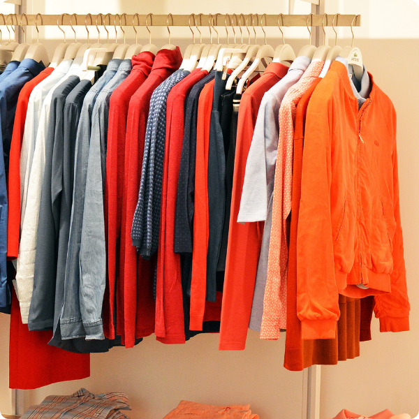 Hanging clothes on a rack.