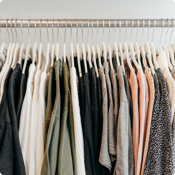 Hanging clothes on a rack.