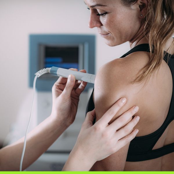 Woman getting an ultrasound on shoulder Woman getting an ultrasound on shoulder