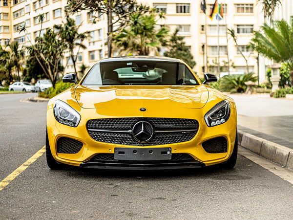 Front view of a yellow Mercedes