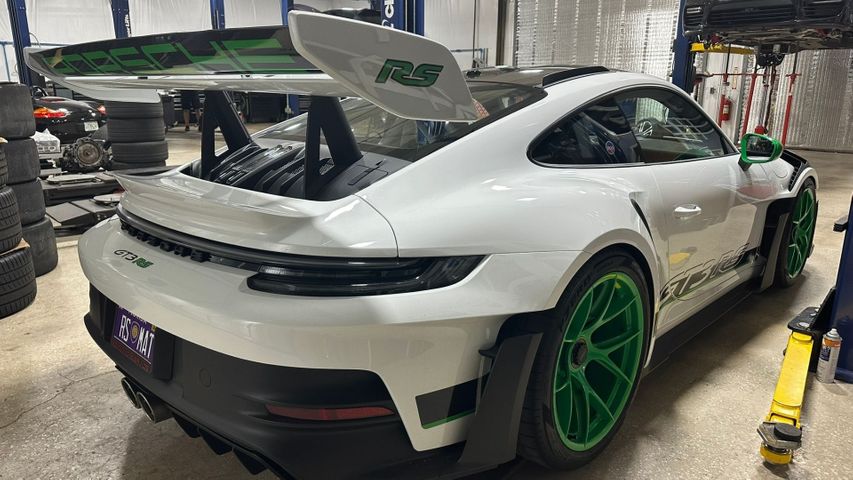 Back view of a Porsche in the repair shop