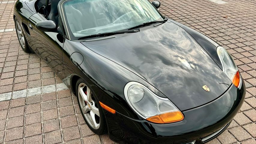 Black convertible Porsche on a sunny day