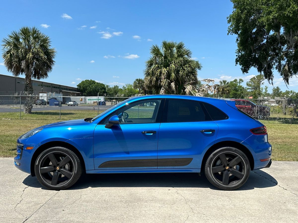 a blue Porsche Macan parked a blue Porsche Macan parked