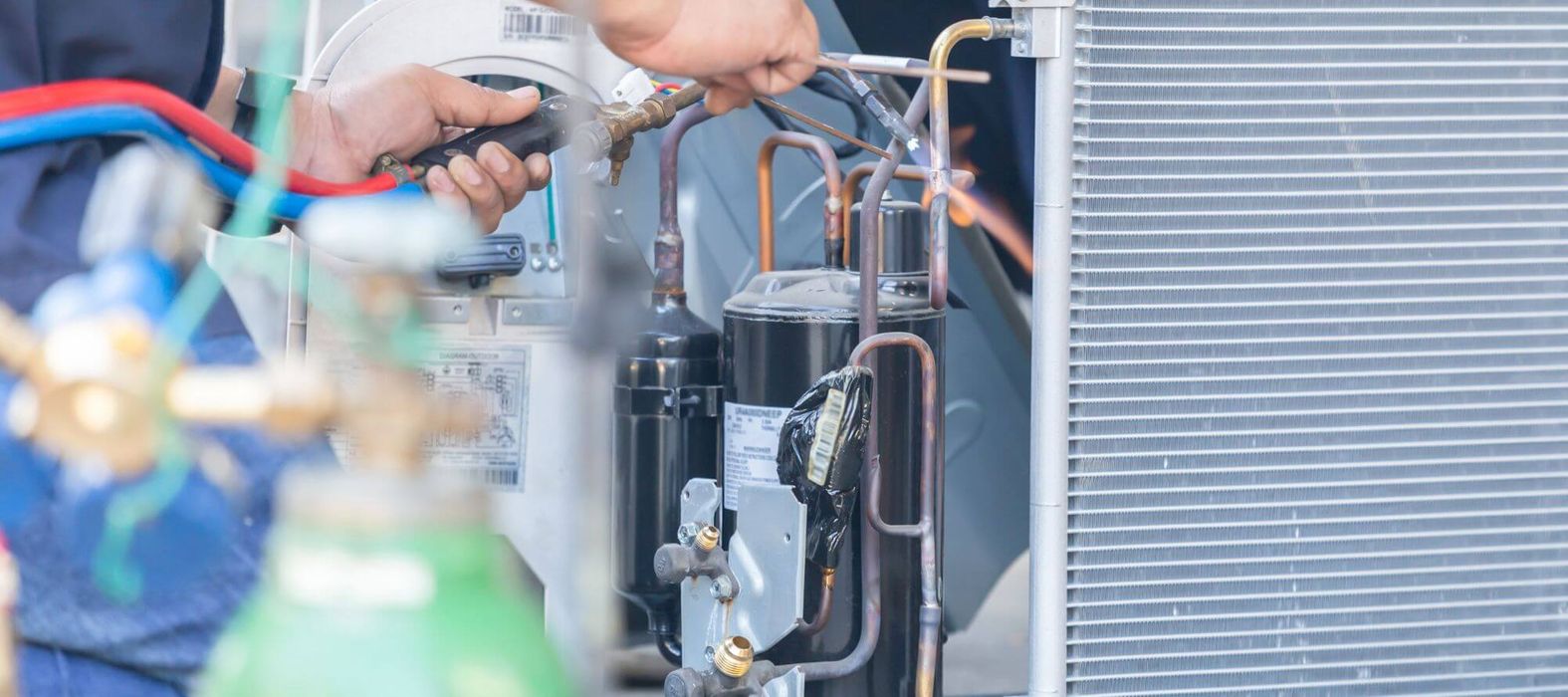 technician repairing furnace