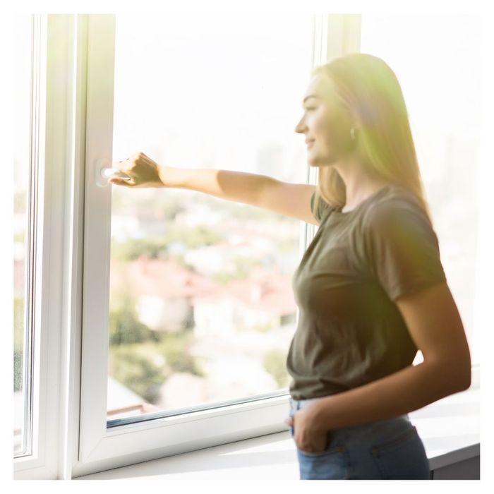 woman looking out of window