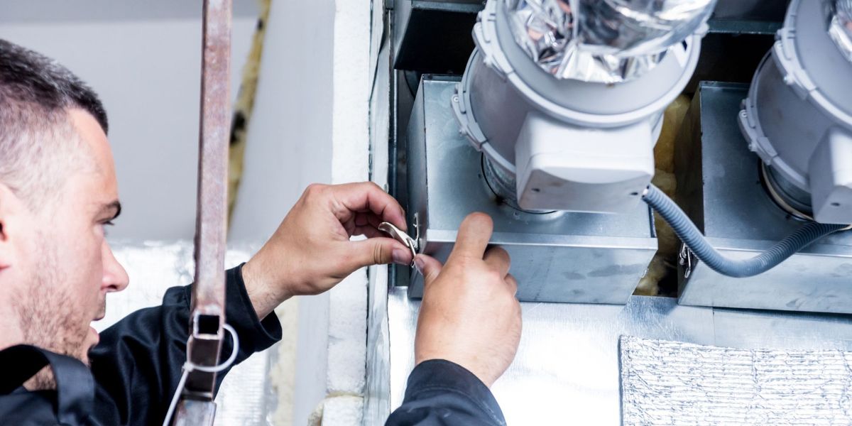 man installing hvac