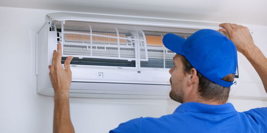 a professional working on an AC unit