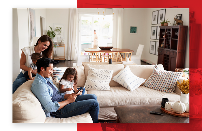 Family sitting on couch in living room