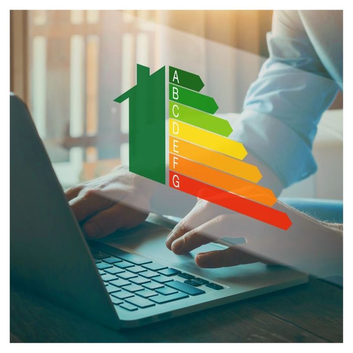 energy efficienty scale on screen with person on laptop