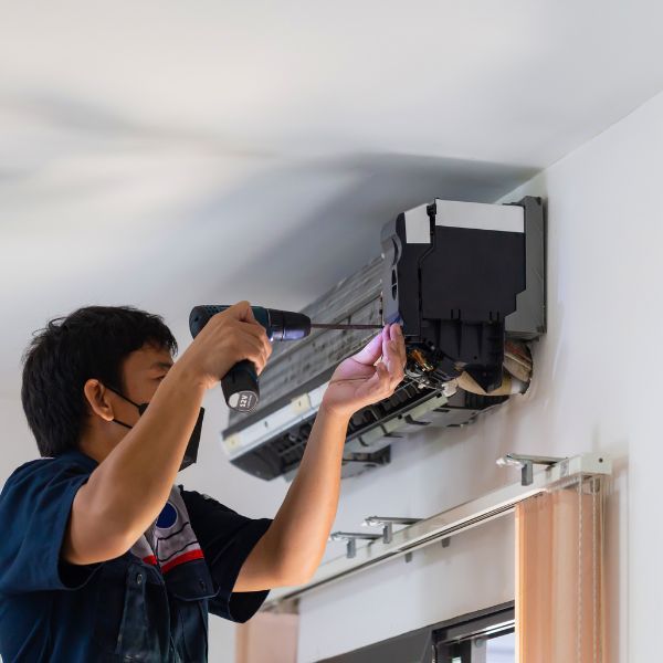 A man working on an ac system