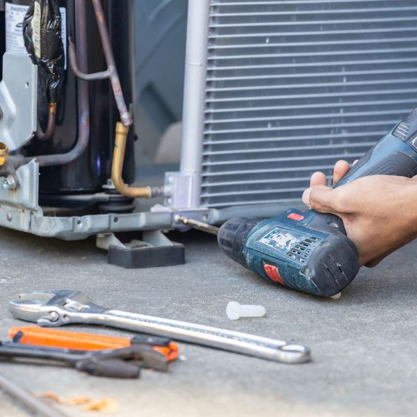 Contractor repairing AC