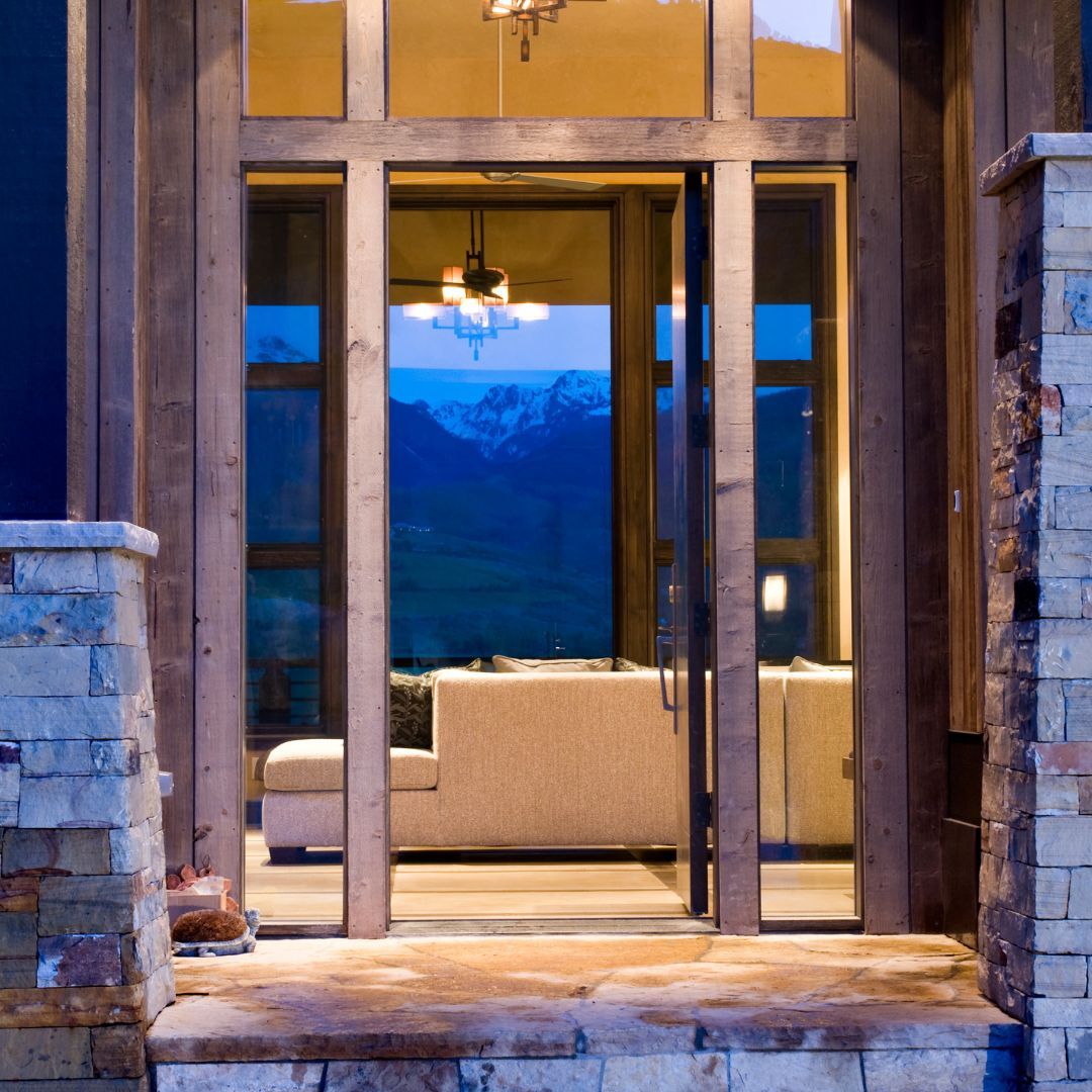 View through a Colorado home, with mountains behind