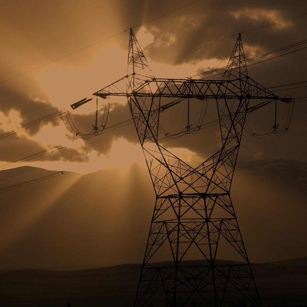 Power lines against a sunset