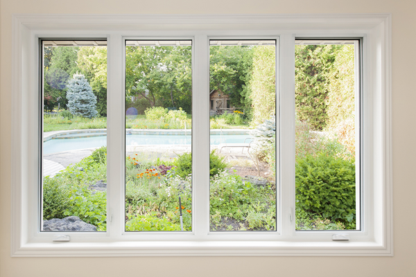 Large modern windows lookinh at a backyard pool