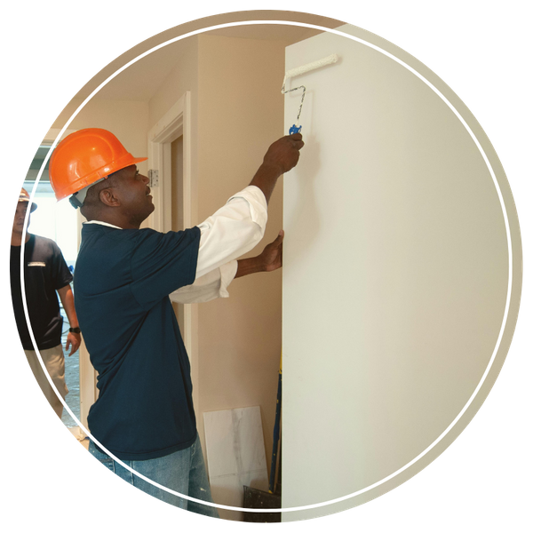 Painting contractor painting a wall