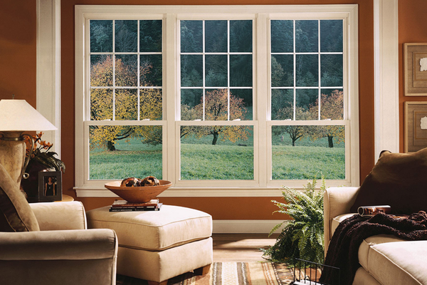 Large windows looking onto a backyard