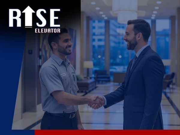 elevator technician shaking hands with business manager