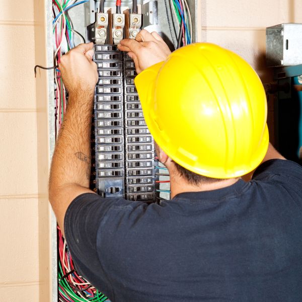 Mechanic in a yellow hardhat