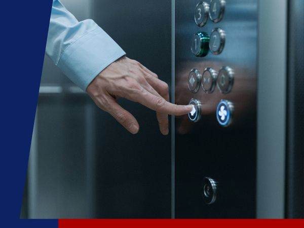 Man pressing elevator button