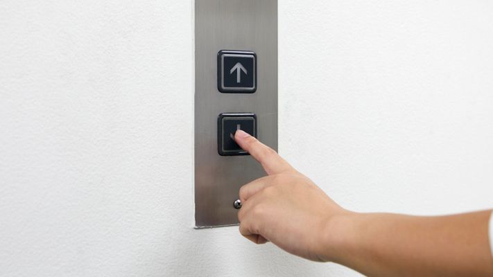 pushing down button of home elevator pushing down button of home elevator