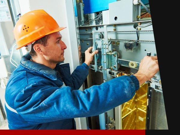 elevator technician making repair