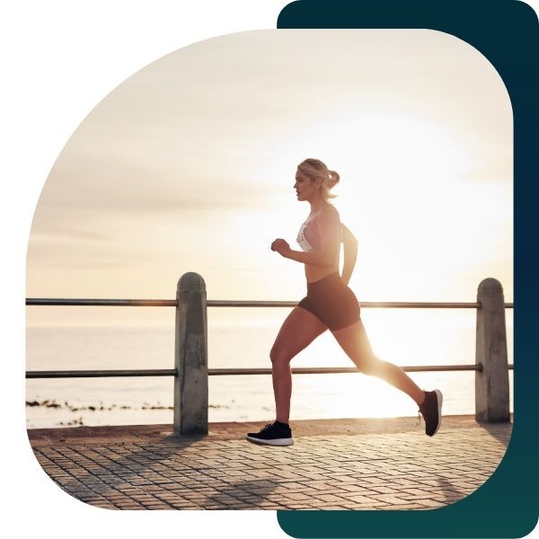 woman running on boardwalk