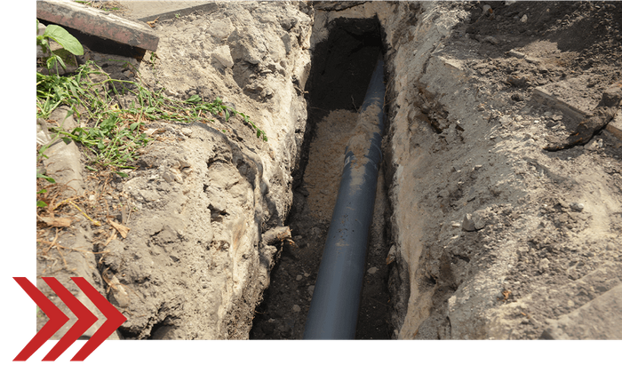 a dug up pipe in the ground