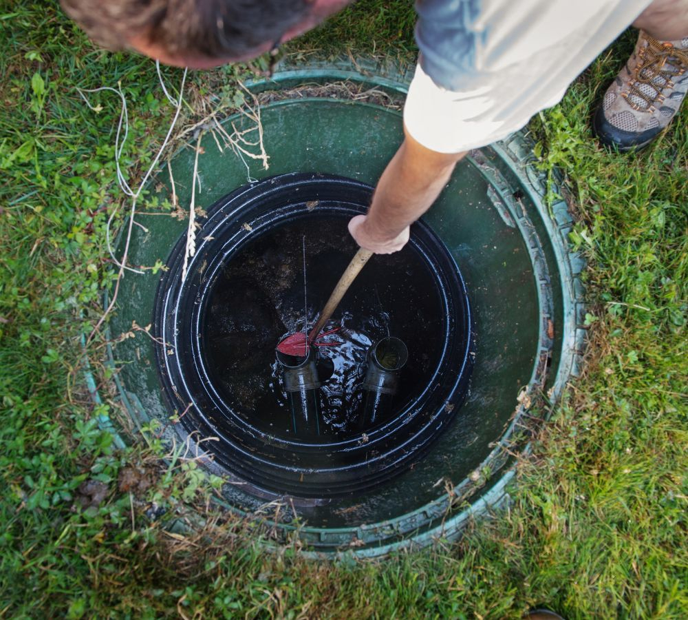 a professional working on a septic system