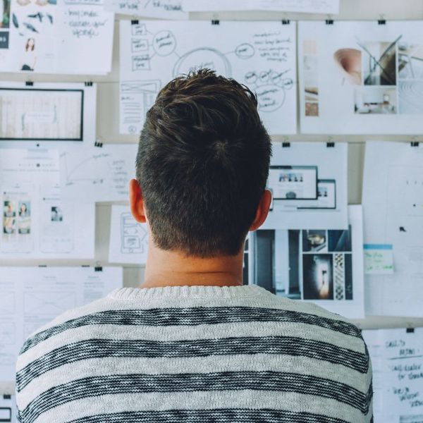 man looking at whiteboard products 4.jpg