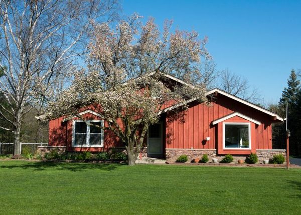 exterior of home with red stained wood