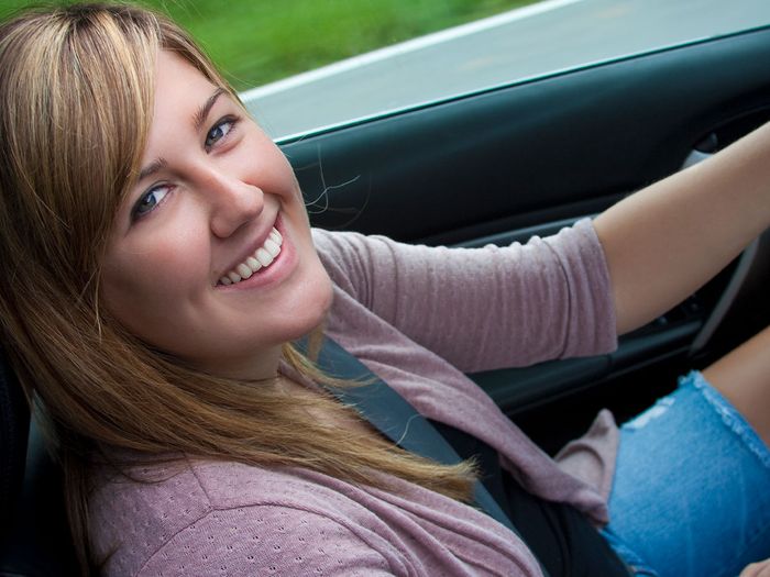 woman smiling in car