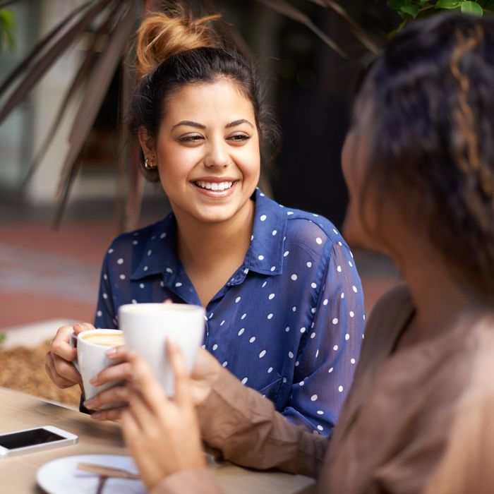 Two people having coffee together