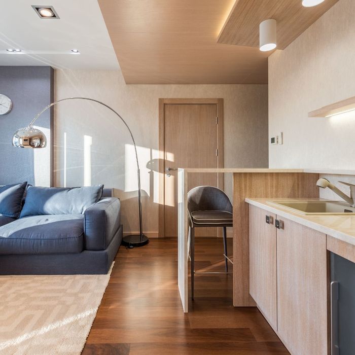 tidy modern apartment with light natural wood accents (stock image)