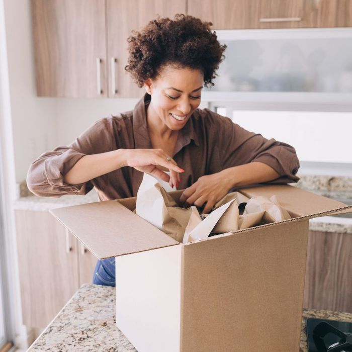 woman unpacking a box