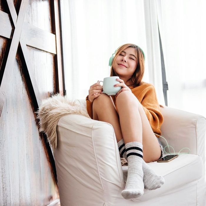 A girl in her apartment enjoying some time to herself