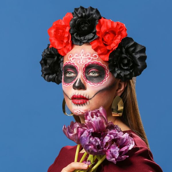 Woman dressed in a festive Day of the Dead costume. 