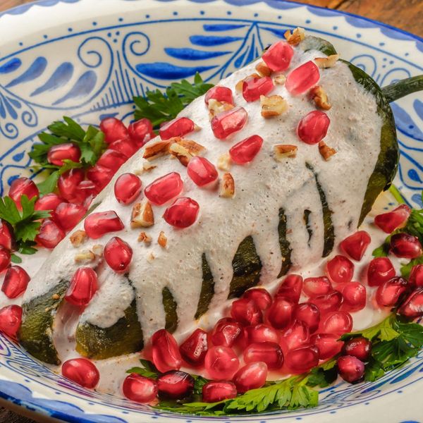 Chiles en nogada on a festive plate. 
