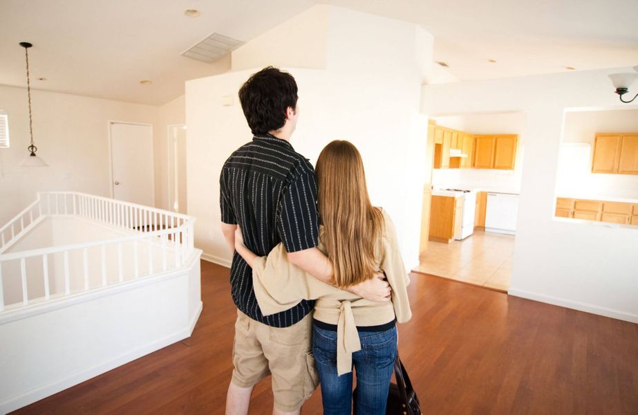 young couple looking at new home