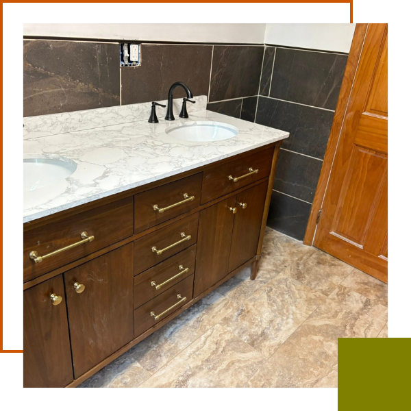new sink and cabinets in a renovated bathroom