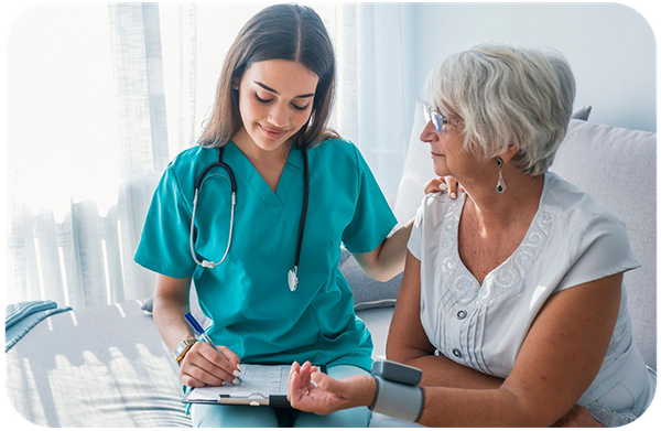 Nurse taking blood pressure of patient