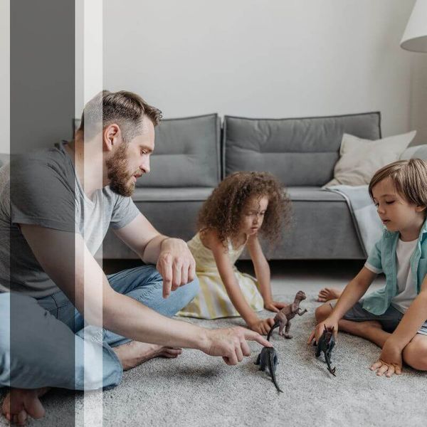 family playing on carpet