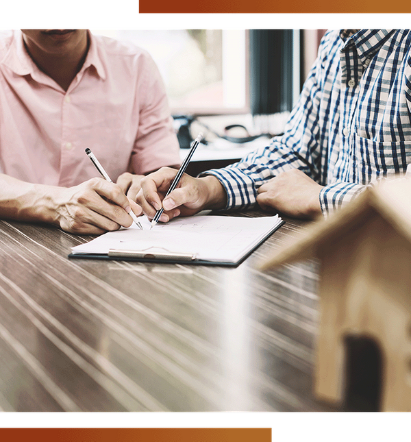 Image of people signing a contract